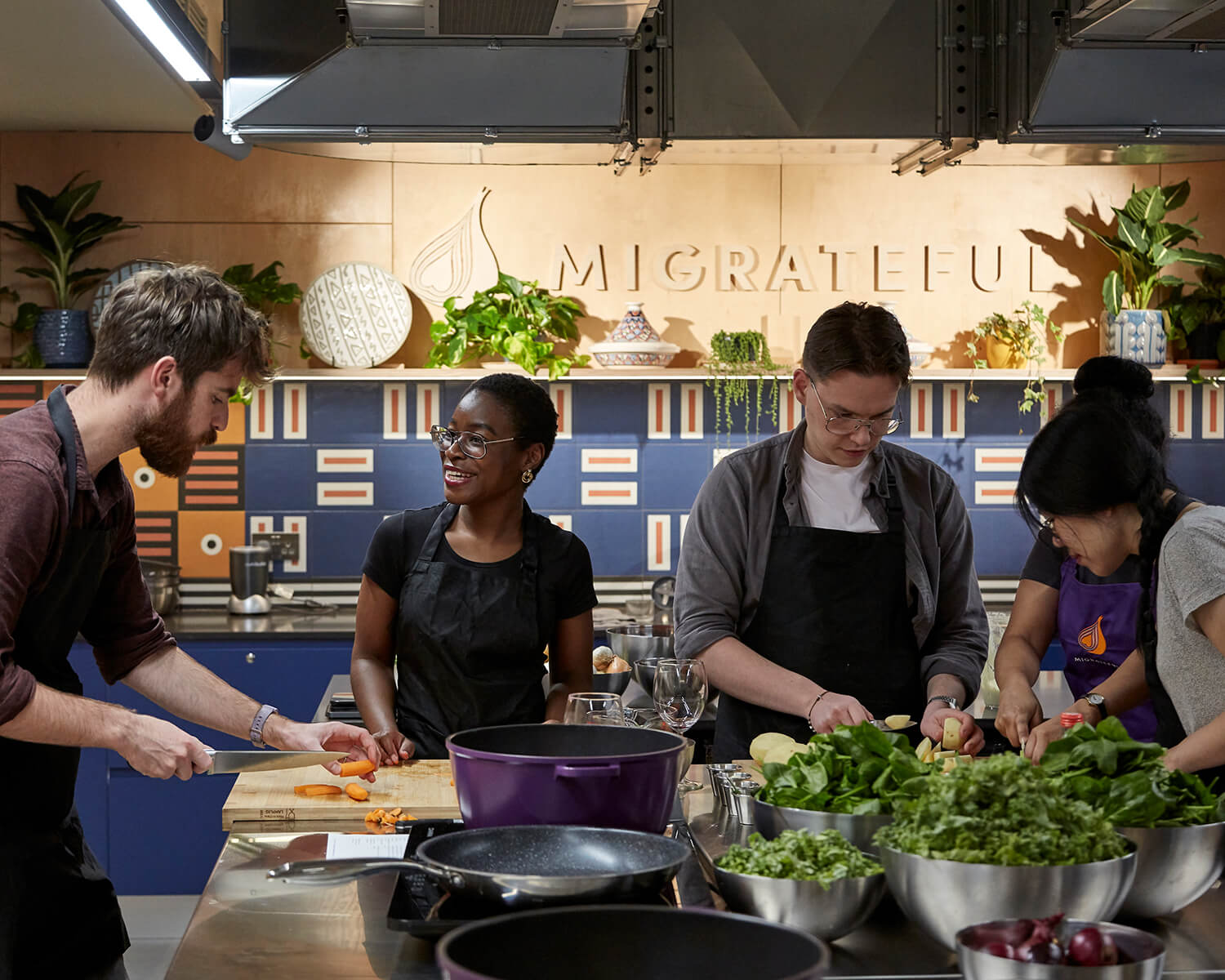 Volunteers collaborating on practical kitchen work